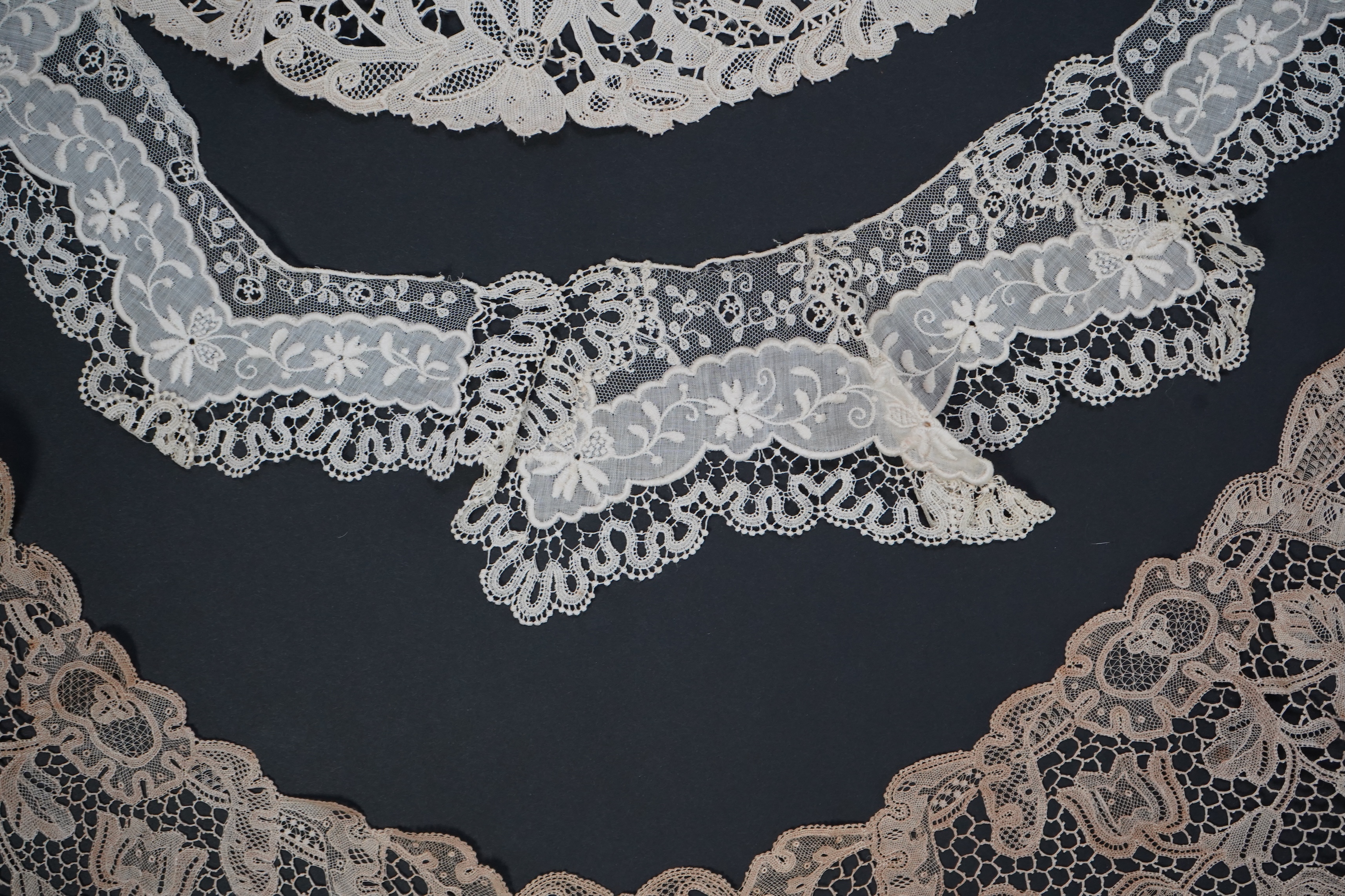 A variety of 19th and 20th century cream lace, being mixed hand and machine collars, lappets, trimmings together with a silk stole. Ideal for tv, film and theatre, stole 230 cm long. Condition - good